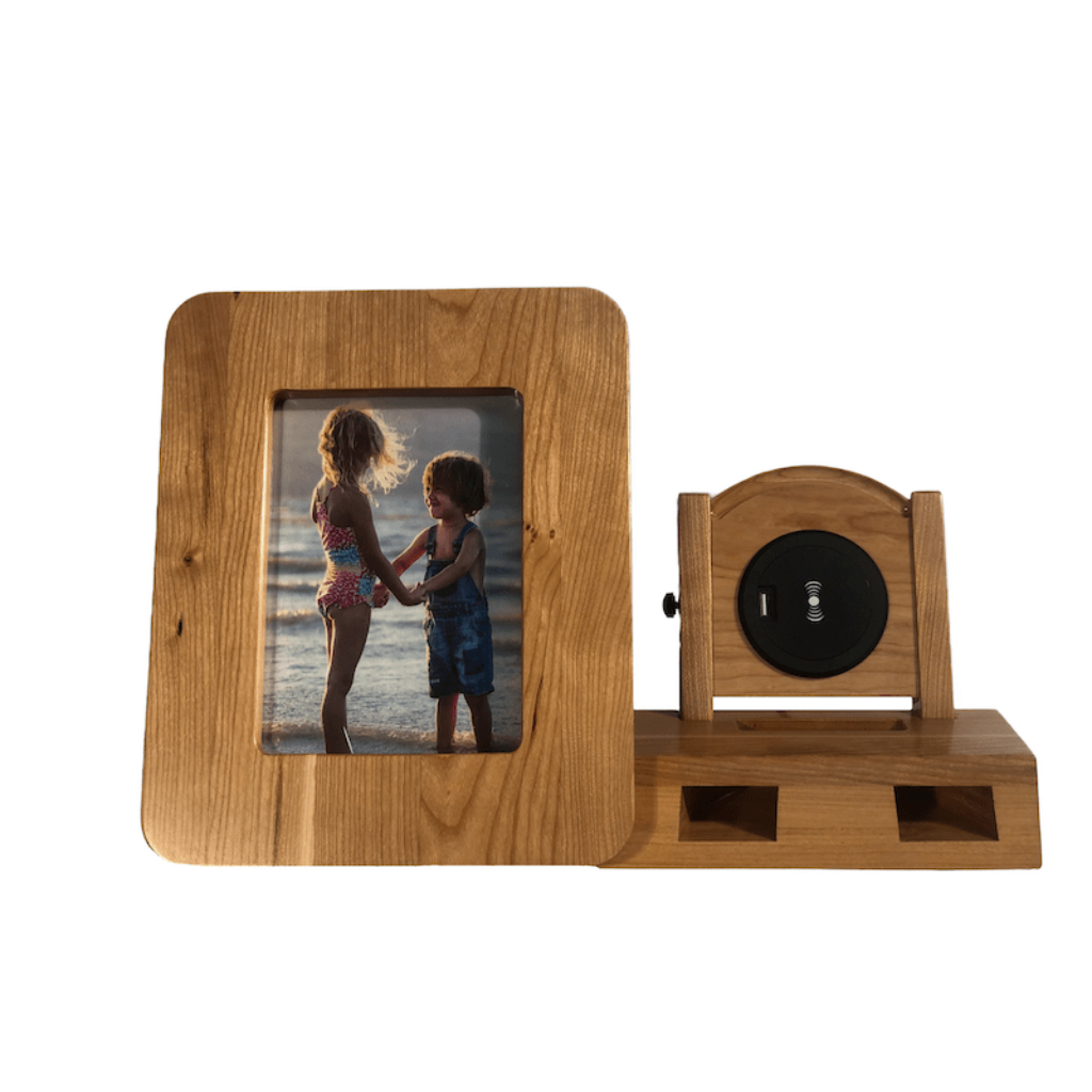 SmartFrame™ wood charging station holds a 5x7 photo, wirelessly charges phones & watches, and amplifies sound. Made in USA.