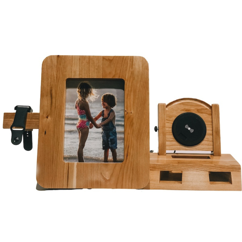 SmartFrame™ wood charging station holds a 5x7 photo, wirelessly charges phones & watches, and amplifies sound. Made in USA.