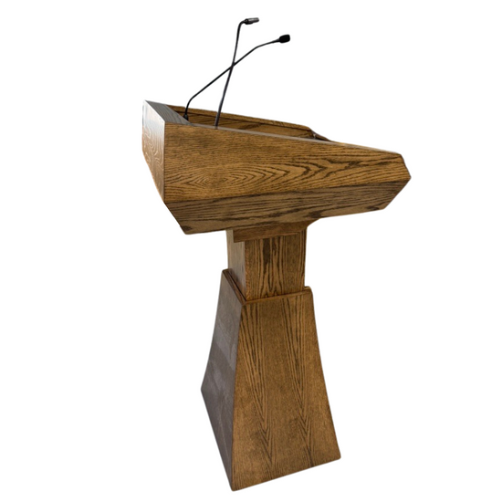 "StatesMan AutoGlide™ Height Adjustable Lift Podium, featuring a smooth, modern design with a sleek lift mechanism, allowing easy adjustment for different speaker heights and creating a versatile and professional presentation space. American made craftsmanship