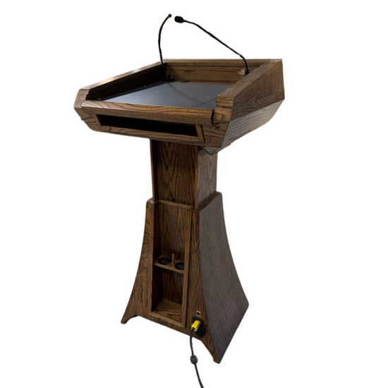 "StatesMan AutoGlide™ Height Adjustable Lift Podium, featuring a smooth, modern design with a sleek lift mechanism, allowing easy adjustment for different speaker heights and creating a versatile and professional presentation space. American made craftsmanship