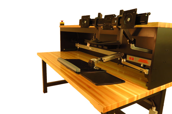 A well-organized durable workbench with tools neatly arranged, a wooden butcher block top surface, and ample storage space for hardware and projects.