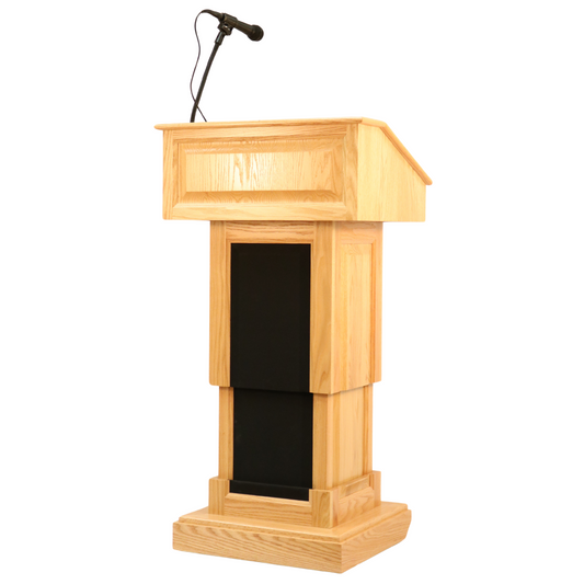 The Counselor Evolution Lift™ podium, handcrafted from premium wood, features power adjustable height, built-in sound system, and casters.