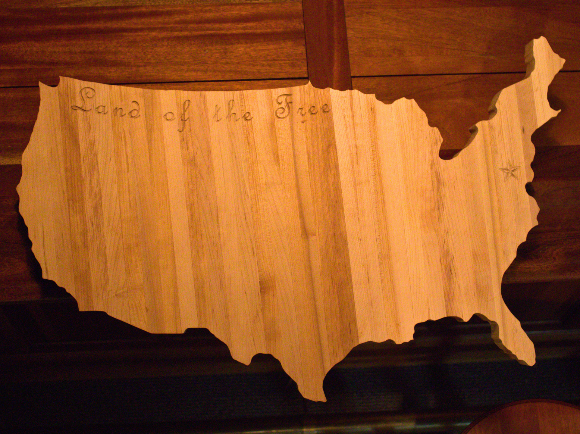 Handcrafted USA charcuterie board in butcher block style, made from American Maple with 'Land of the Free' engraving and DC star.