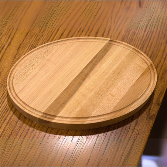 Handcrafted Character Maple cutting board with juice grooves, food-safe finish, and custom engraving options. Made in the USA.