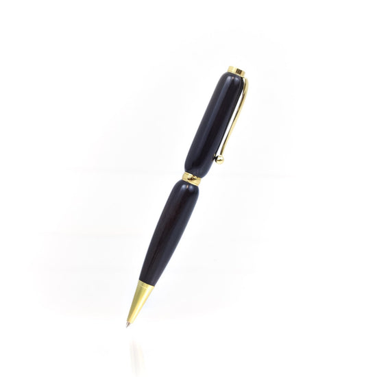 Handcrafted African Blackwood pen with glossy finish and refillable black ballpoint ink insert, made in Missouri