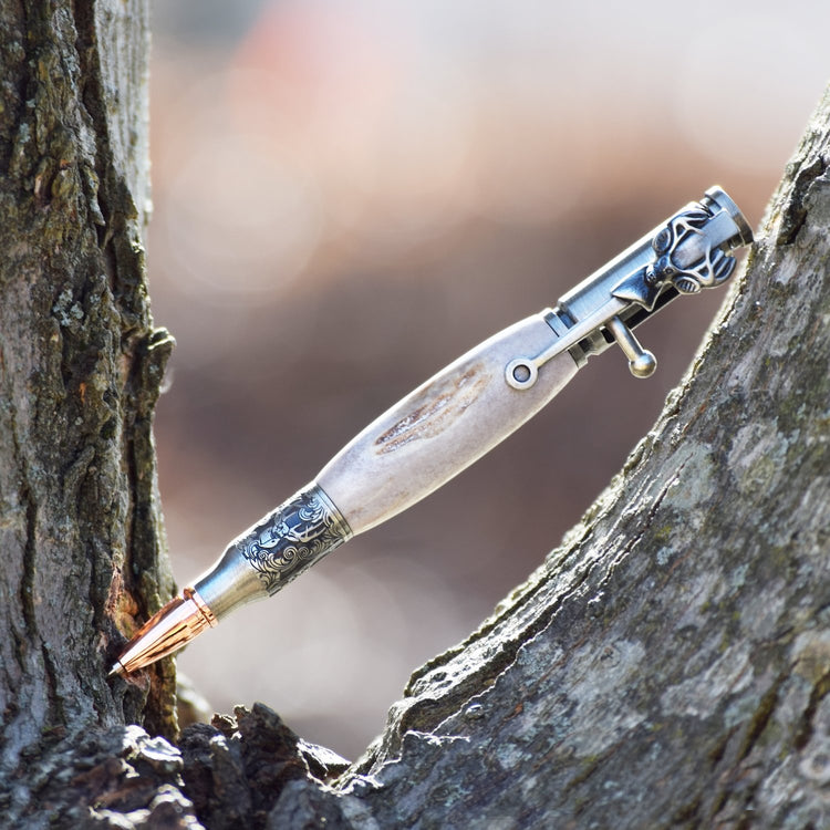 Handcrafted deer antler bolt action pen with deer clip, bullet tip, and refillable black ballpoint ink, made in Missouri