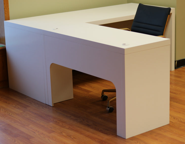 Modern white L-shaped desk of durable maple, with spacious surface, cable grommets, easy assembly for home or office use