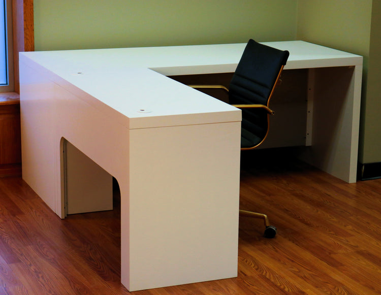 Modern white L-shaped desk of durable maple, with spacious surface, cable grommets, easy assembly for home or office use