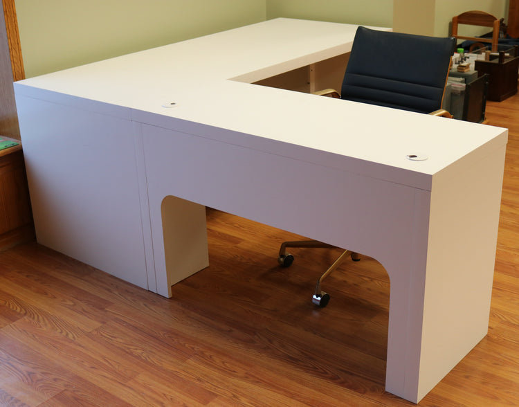 Modern white L-shaped desk of durable maple, with spacious surface, cable grommets, easy assembly for home or office use