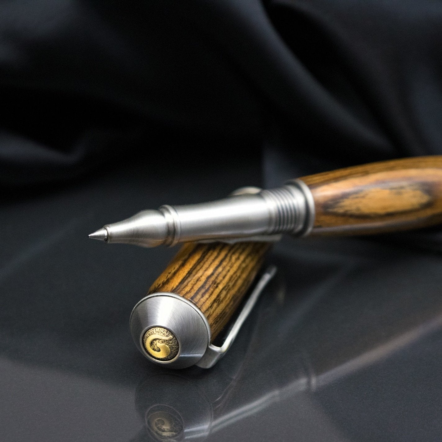 Handcrafted Bocote wood rollerball pen with precious metal body
