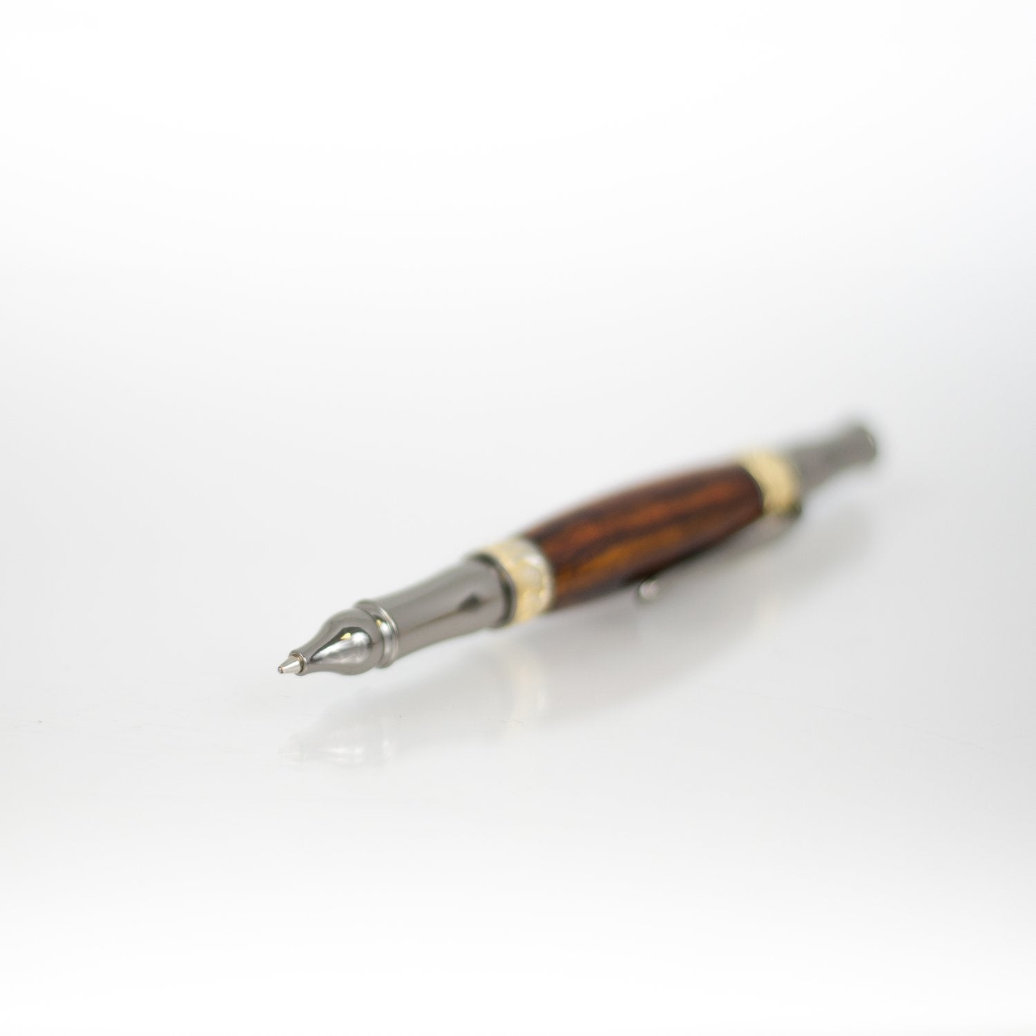 Handcrafted Bocote rollerball pen with 24K gold accents and metal body