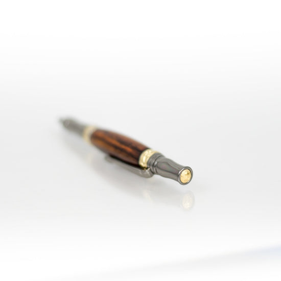 Handcrafted Bocote rollerball pen with 24K gold accents and metal body