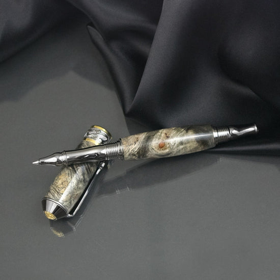 Handcrafted Buckeye Burl rollerball pen with precious metal body