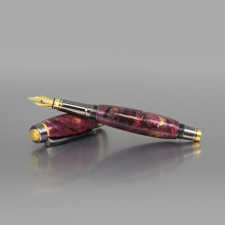 Handcrafted mauve Buckeye Burl executive fountain pen with sleek metal body