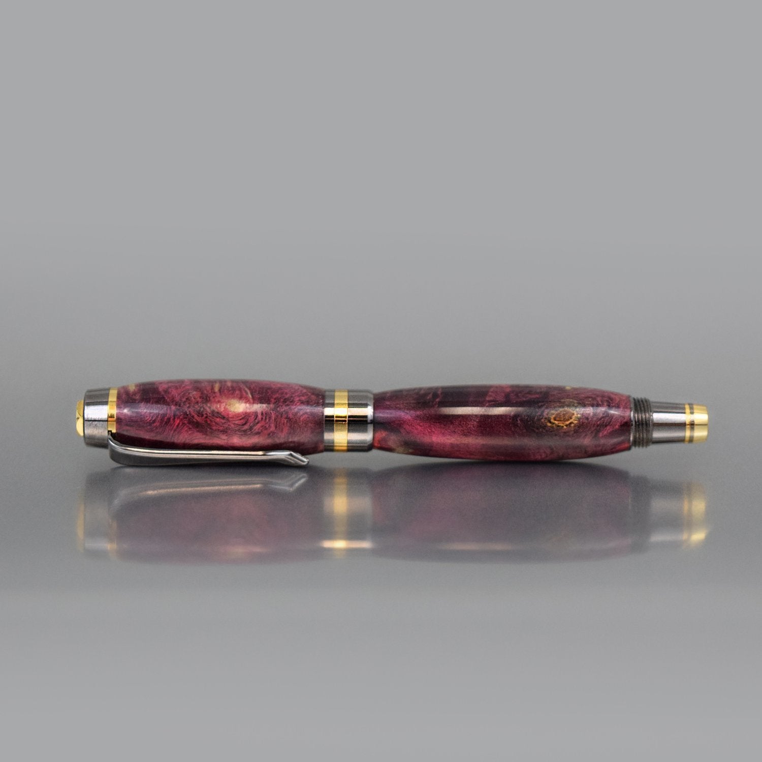 Handcrafted mauve Buckeye Burl executive fountain pen with sleek metal body