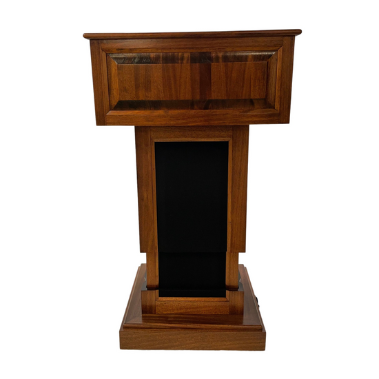 The Counselor Evolution Lift™ lectern, handcrafted from premium wood, features adjustable height, built-in sound system, and mobility casters.