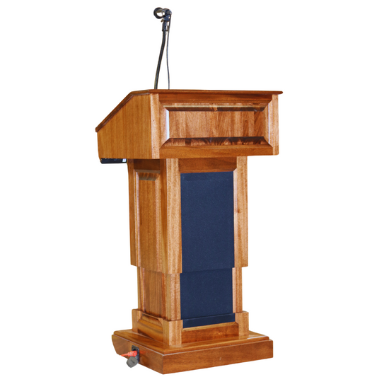 The Counselor Evolution Lift™ podium, handcrafted from premium wood, features power adjustable height, built-in sound system, and casters.