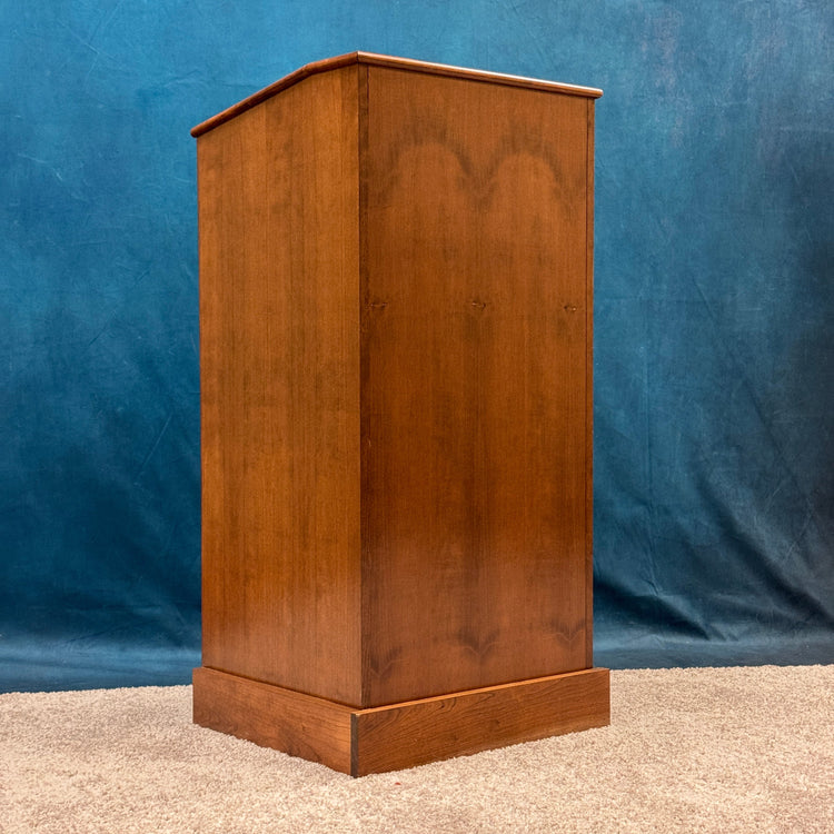 Wooden podium on a blue fabric background