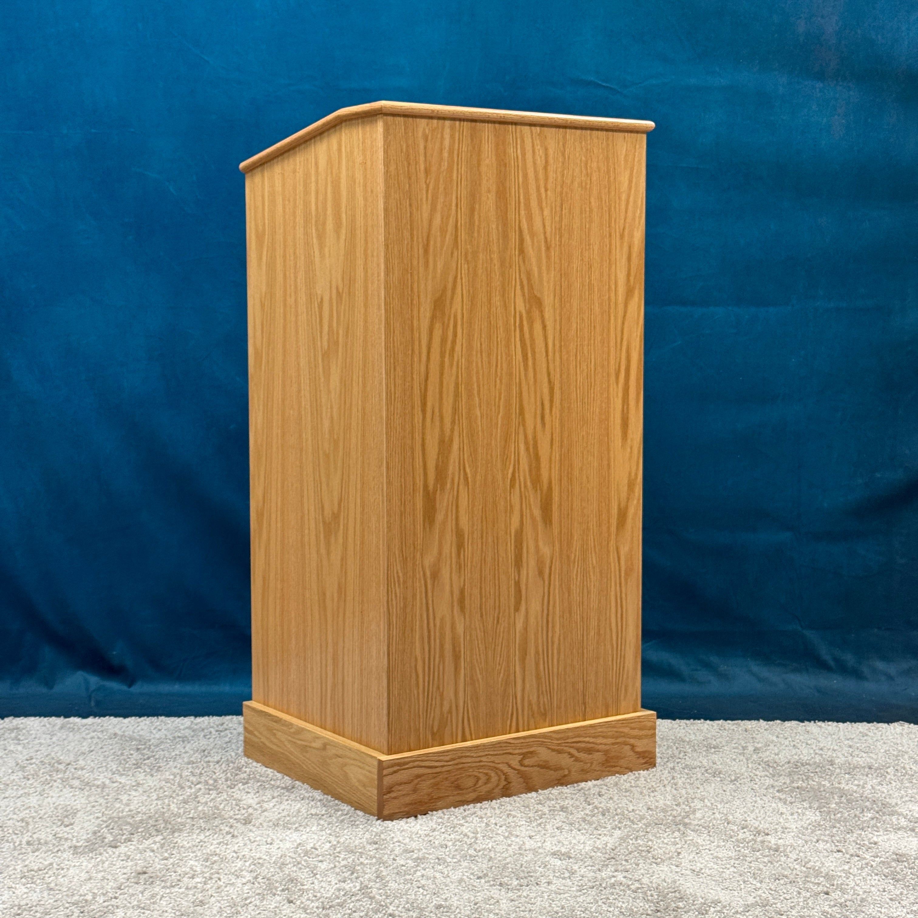 Wooden podium against a blue background