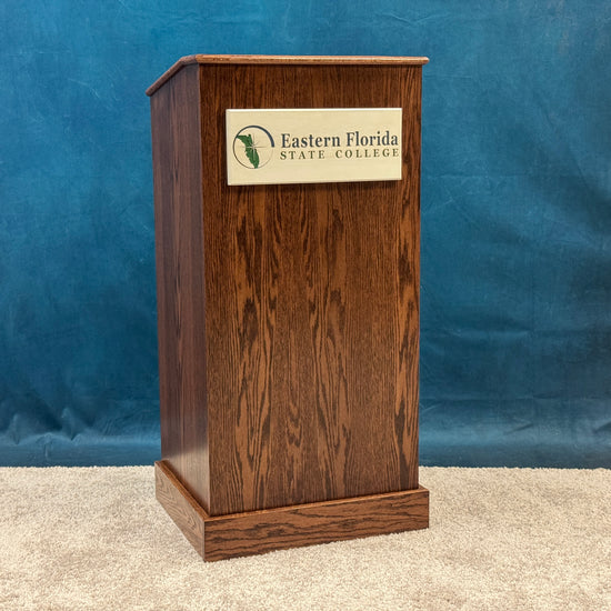 Wooden podium with Eastern Florida State College logo against a blue background