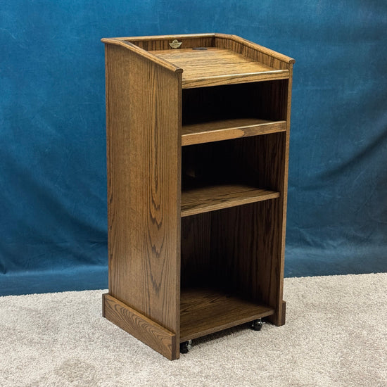 Wooden podium against a blue backdrop