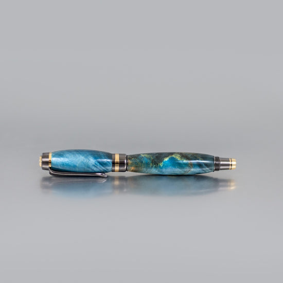 Small-town handcrafted Buckeye Burl wood rollerball pen