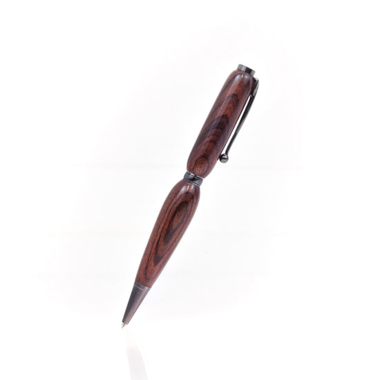 Handcrafted Kingwood (Violetwood) pen with natural purple streaks, glossy finish, and refillable black ballpoint ink insert, made in Missouri