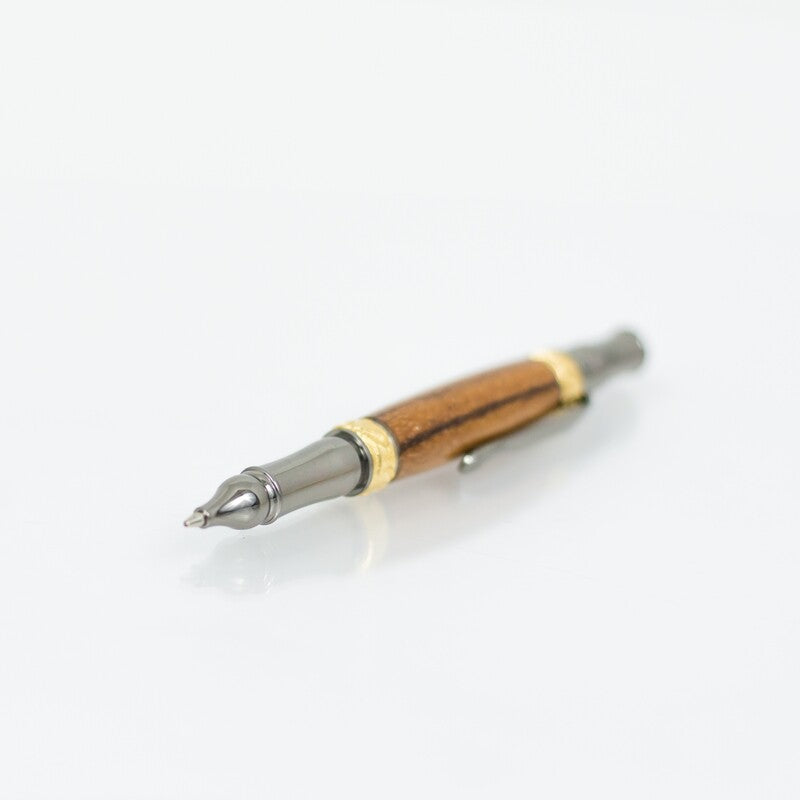 Handcrafted Marblewood rollerball pen with 24K gold accents