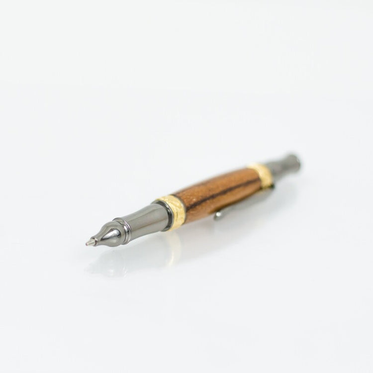 Handcrafted Marblewood rollerball pen with 24K gold accents
