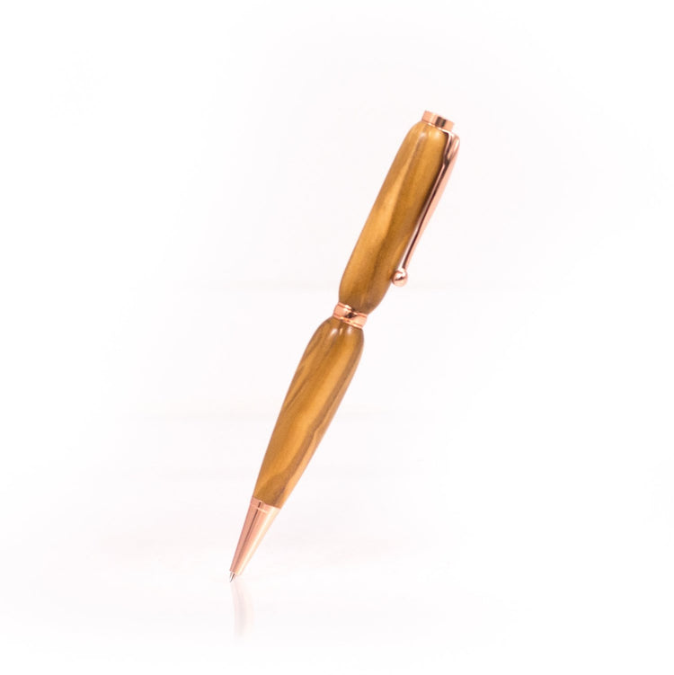 Handcrafted Olivewood pen with flowing grain, glossy finish, and refillable black ballpoint ink insert, made in Missouri