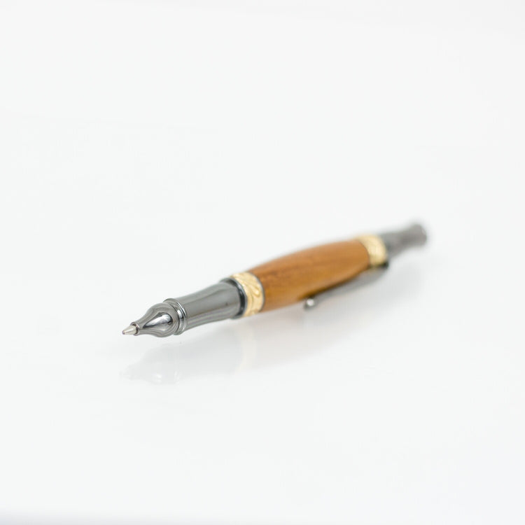 Handcrafted Osage Orange rollerball pen with 24K gold accents and metal body