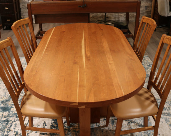 Solid top cherry oval conference table, 72” x 34.5”, handcrafted in the USA for executive offices, boardrooms, and professional spaces.