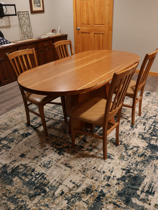 Solid top cherry oval conference table, 72” x 34.5”, handcrafted in the USA for executive offices, boardrooms, and professional spaces.