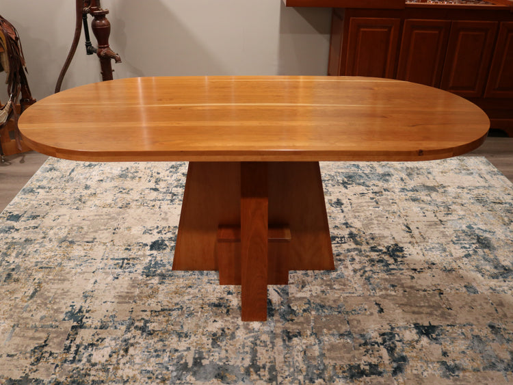 Solid top cherry oval conference table, 72” x 34.5”, handcrafted in the USA for executive offices, boardrooms, and professional spaces.