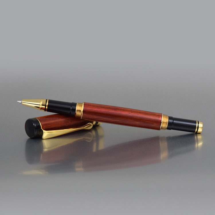 Exotic Padauk wood pen with high-gloss finish and refillable rollerball tip