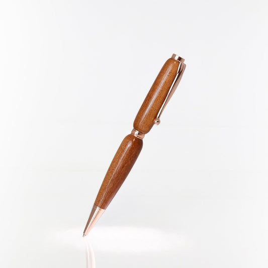 Handcrafted Pink Ivory wood pen with polished high-gloss finish and refillable black ballpoint ink insert