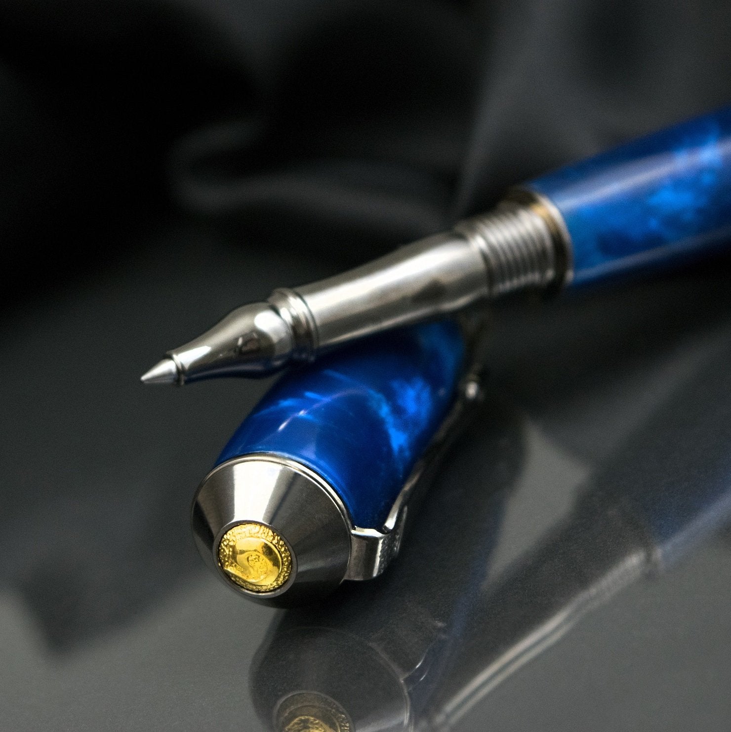 Handcrafted sapphire acrylic rollerball pen with precious metal body