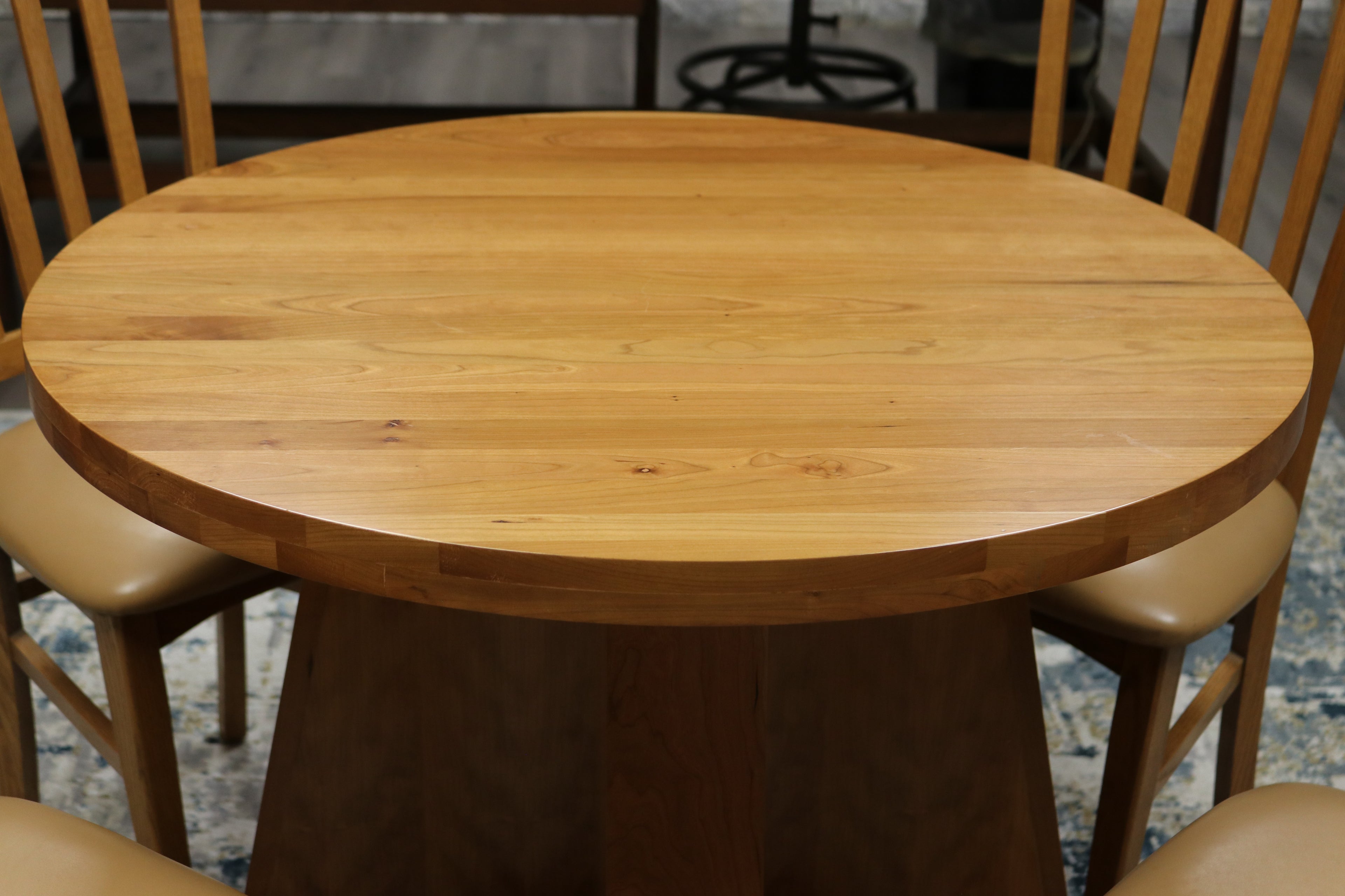 Handcrafted solid cherry wood round collaboration table, 34.5-inch diameter, perfect for executive offices, boardrooms, and upscale workspaces.