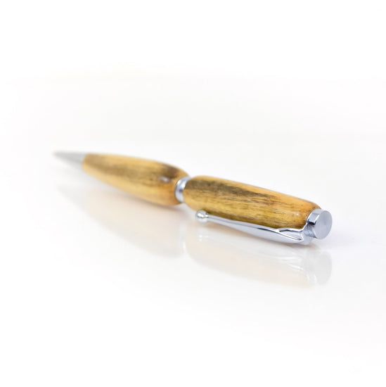 Handcrafted Spalted Maple pen with distinctive dark vein patterns, glossy finish, and refillable black ballpoint ink insert, made in Missouri